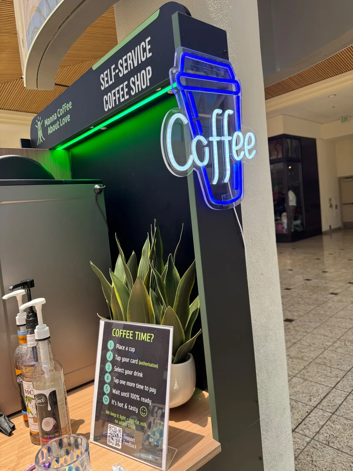 A Manna coffee kiosk in a self-service coffee corner